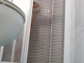 Spying on enticing Wife Shaving Pussy in Shower