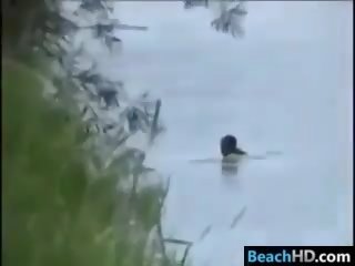 Spying On Couple At The Beach